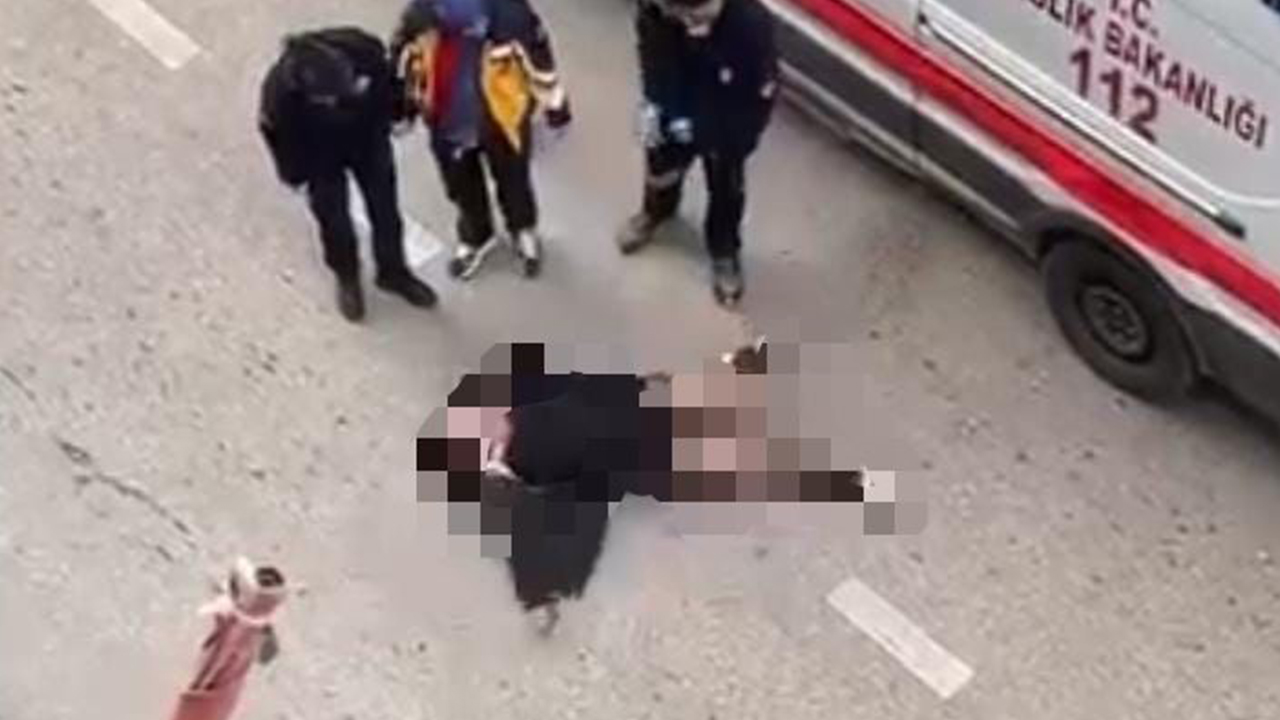 Yolun ortasında yatan kadın, sinir krizi geçirdi